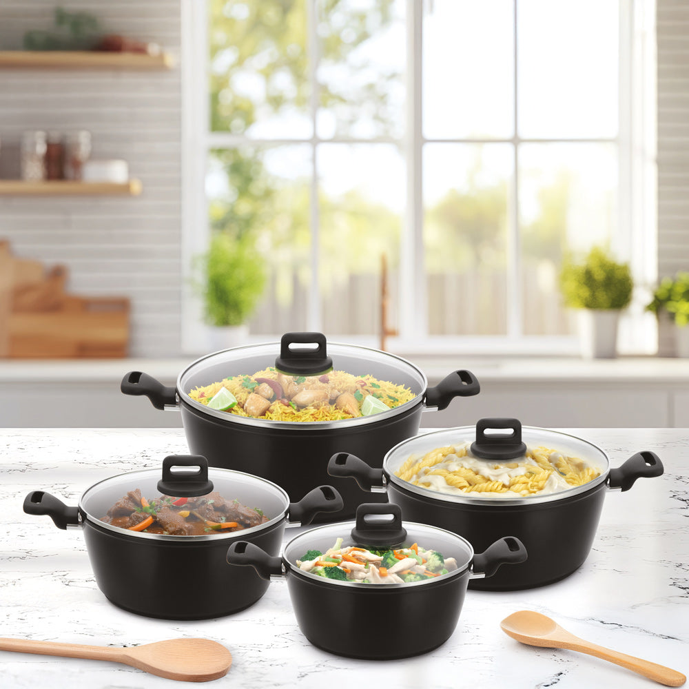 SQ Professional Zoya 4 piece stockpot set with tempered glass lids, non-stick ceramic coating cookware shown with food in a modern kitchen