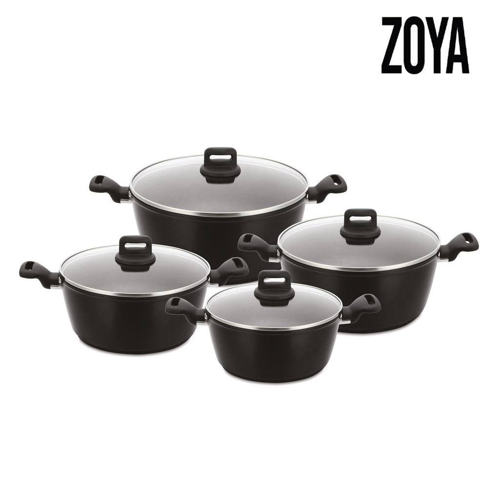 A Zoya 4-piece cookware set featuring black non-stick pots with matching handles and transparent glass lids, arranged on a white background.