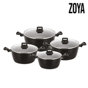A Zoya 4-piece cookware set featuring black non-stick pots with matching handles and transparent glass lids, arranged on a white background.